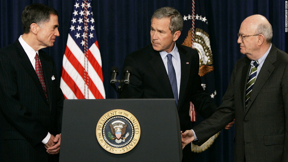 President Bush shakes hands with former Sen. Charles Robb, left, and Judge Laurence Silberman during a news conference in Washington on March 31, 2005. The co-chairmen of the Iraqi Intelligence Commission issued a report indicating that U.S. intelligence agencies were wrong in most pre-war assessments about weapons of mass destruction in Iraq.