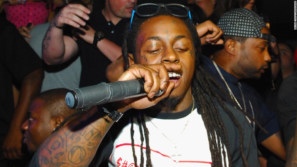 Rapper Lil Wayne has tons of tattoos. Among them are the words "fear ...