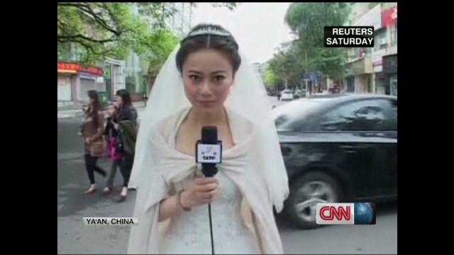 reporter in wedding dress