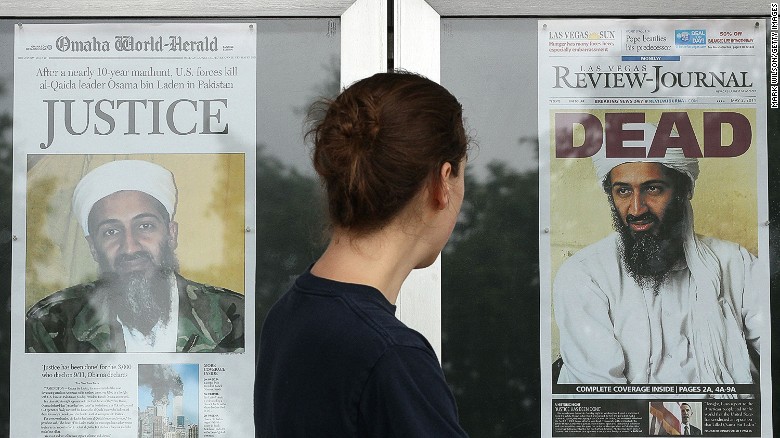 A passerby looks at news headlines in front of the Newseum in Washington in 2011.
