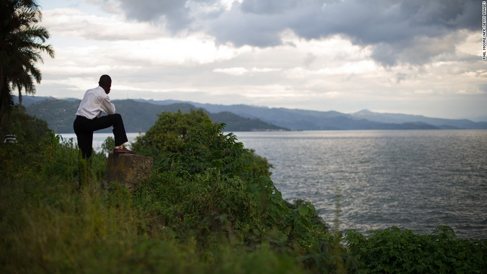 A man looks out toward the hills of Rwanda from the eastern edge of Lake Kivu in the Democratic Republic of the Congo&#39;s eastern city of Goma. Congo is the crossroads of Africa, bordered by nine countries. It is the continent&#39;s second-largest country in area (behind Algeria) and fourth-largest in population (behind Nigeria, Ethiopia and Egypt).