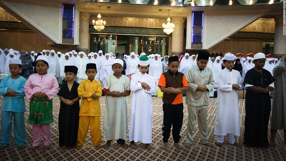 A row of children joins the night prayer known as Tarawih on Tuesday, July 16, in Kuala Lumpur, Malaysia.