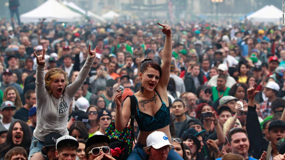 Members of a crowd numbering tens of thousands smoke and listen to live music at the Denver 420 Rally on April 20, 2013. <a href="http://www.cnn.com/2013/04/20/opinion/reiman-marijuana-day/index.html">Annual festivals celebrating marijuana</a> are held around the world on April 20, a counterculture holiday.
