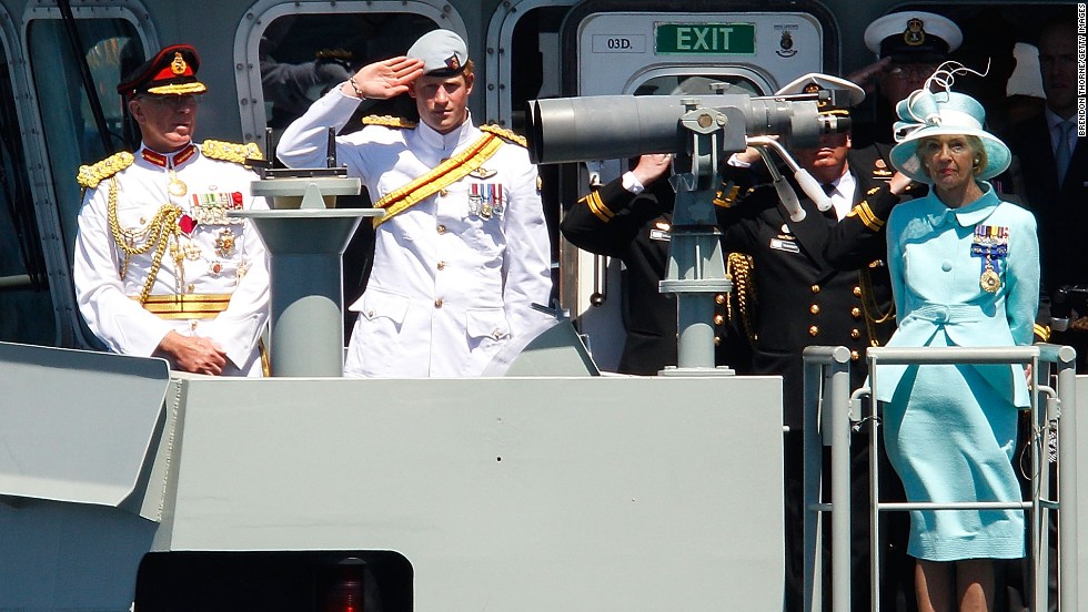 Prince Harry salutes aboard the Australian warship HMAS Leeuwin during the International Fleet Review in Sydney on October 5, 2013.