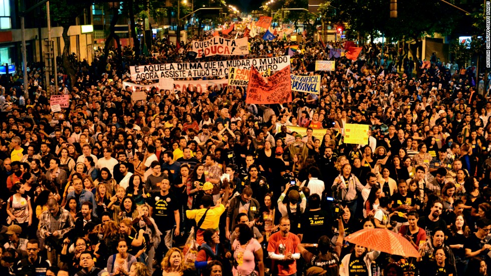 Thousands of people take part in a protest where Brazilian teachers are demanding better working conditions on October 7, in Rio de Janeiro. While the majority of protesters were peaceful, a small group fired incendiary devices and the police eventually dispersed the crowd with tear gas. The last few weeks have seen a citywide strike by union education workers in Rio. Police used tear gas to disperse a group of around 100 protesting teachers last week.