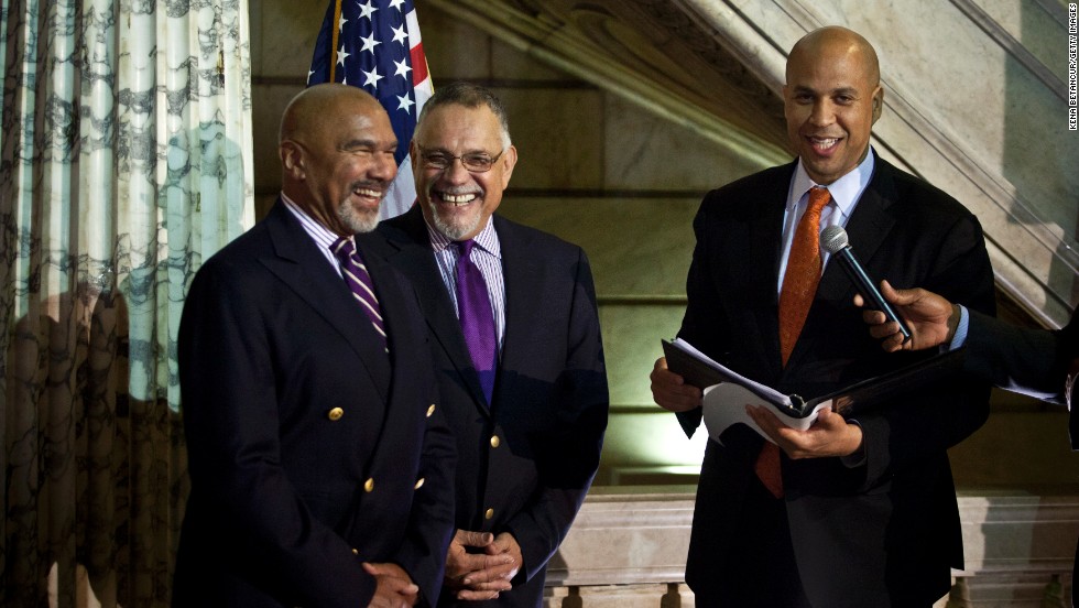 Newark, New Jersey, Mayor Cory Booker officiates a wedding ceremony for Joseph Panessidi and Orville Bell at City Hall in October 2013. The state Supreme Court denied the state&#39;s request to prevent same-sex marriages temporarily, clearing the way for same-sex couples to marry.