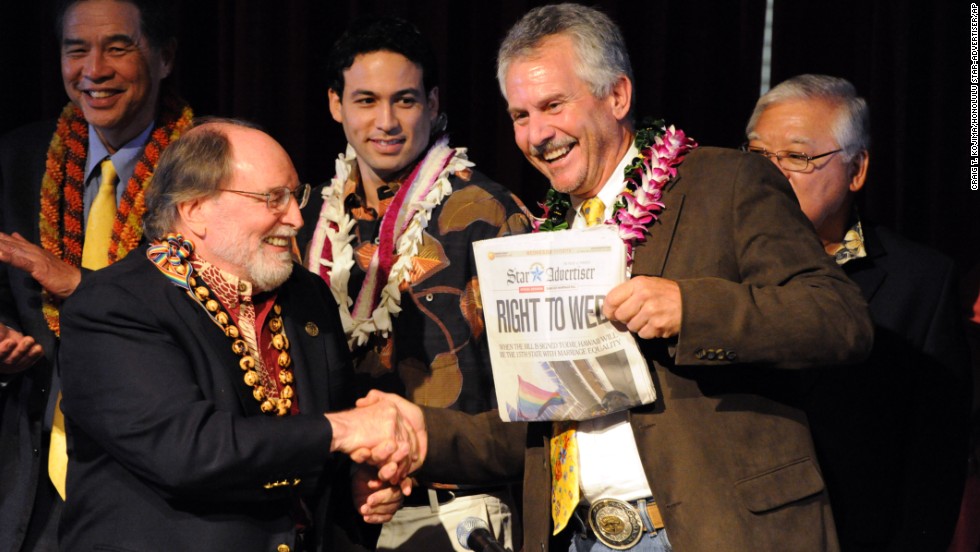 Hawaiian Gov. Neil Abercrombie, left, and former Sen. Avery Chumbley celebrate with a copy of the Star-Advertiser after Abercrombie signed a bill legalizing same-sex marriage in Hawaii in November 2013.