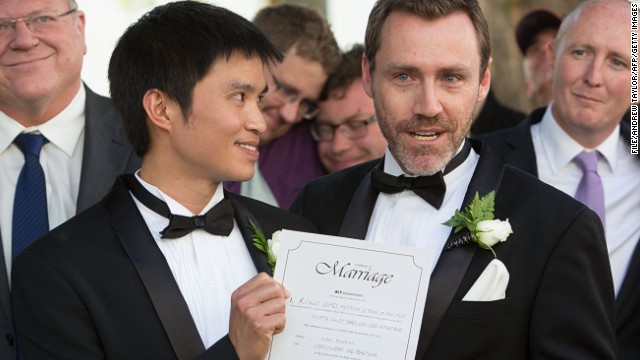 gay men in suits having sex in a warehouse