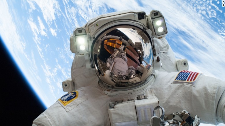 On Dec. 24, 2013, NASA astronaut Mike Hopkins, Expedition 38 Flight Engineer, participates in the second of two spacewalks, spread over a four-day period, which were designed to allow the crew to change out a degraded pump module on the exterior of the Earth-orbiting International Space Station. He was joined on both spacewalks by NASA astronaut Rick Mastracchio, whose image shows up in Hopkins' helmet visor.