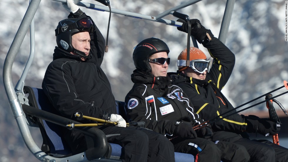 Putin and his Prime Minister Dmitry Medvedev ride in a cable car as they visit the Cross Country and Biathlon Center in Sochi. 