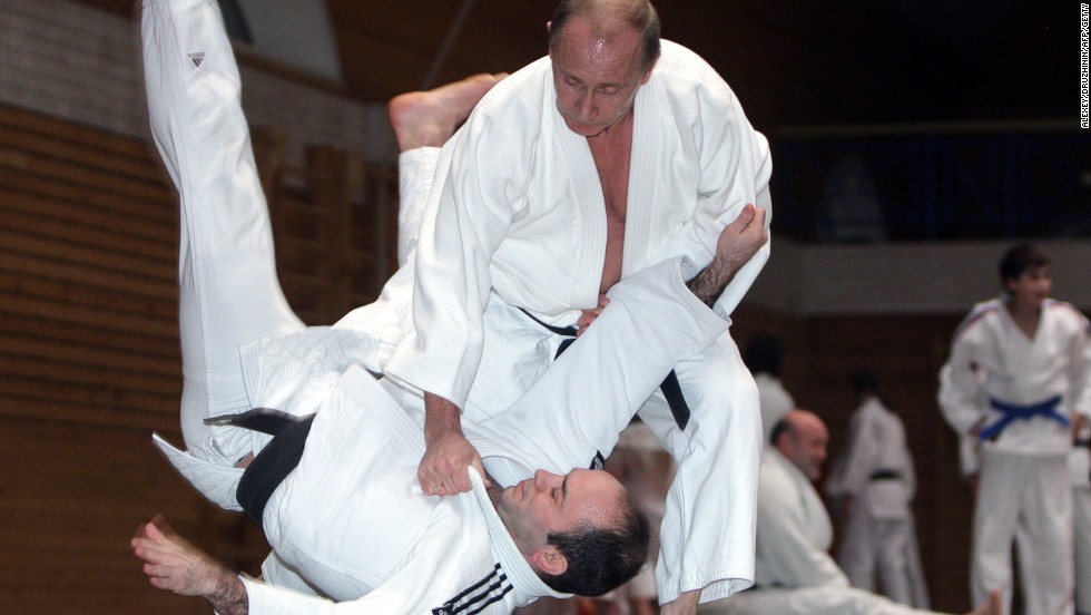 Putin shows off his legendary judo skills on a visit to a center in St Petersburg.