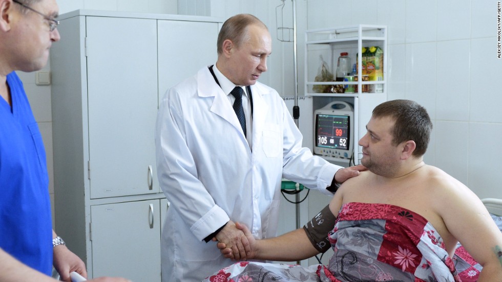 Putin visits a hospital in Volgograd on New Year&#39;s Day to visit survivors of two explosions in the city which have called into question security at the 2014 Winter Games.