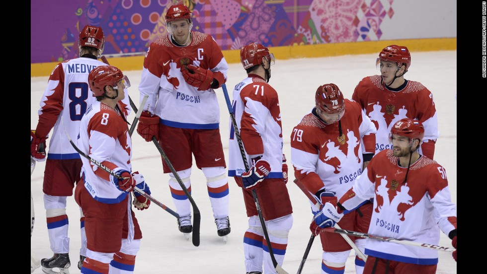 The men's hockey team from Russia looks dejected after losing to Finland on February 19.