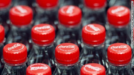 This photo taken on June 7, 2013, in Clamart, near Paris, shows newly produced Coca-Cola soft drink bottles on an assembly line at a Coca Cola bottling plant. AFP PHOTO / LIONEL BONAVENTURE (Photo credit should read LIONEL BONAVENTURE/AFP/Getty Images)