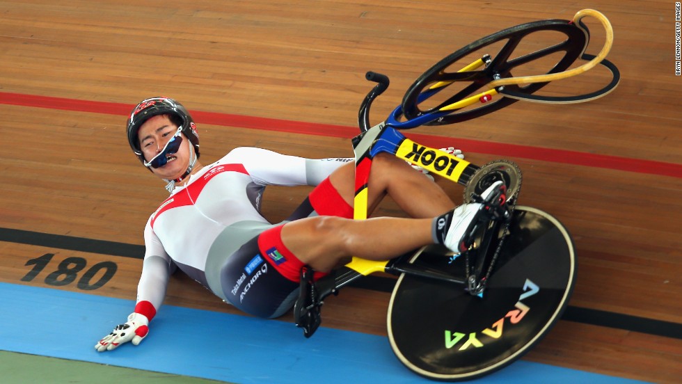 Yuta Wakimoto of Japan slides down the track after crashing during the keirin competition Wednesday, February 26, at the UCI Track Cycling World Championships in Cali, Colombia.
