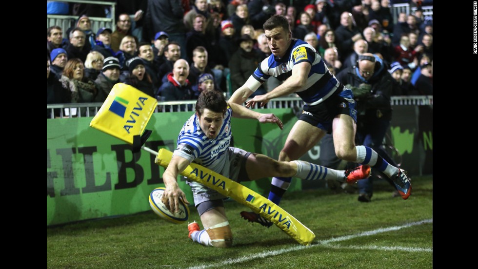 Joel Tomkins, a rugby player for Saracens, crashes into a flag post just short of the try line during a Premiership match against Bath on Friday, February 28, in Bath, England.