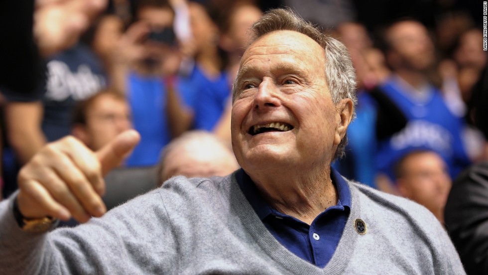 Former President George H.W. Bush attends a college basketball game between North Carolina State and Duke in Durham, North Carolina, on January 18, 2014. Click through the images to see Bush&#39;s life in pictures. 