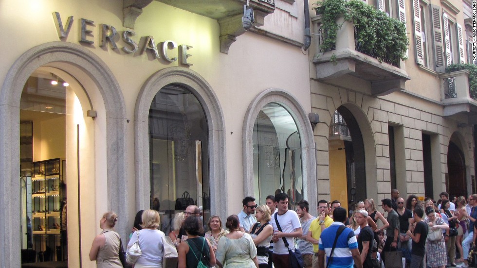The besuited fashionistas must be inside the store.