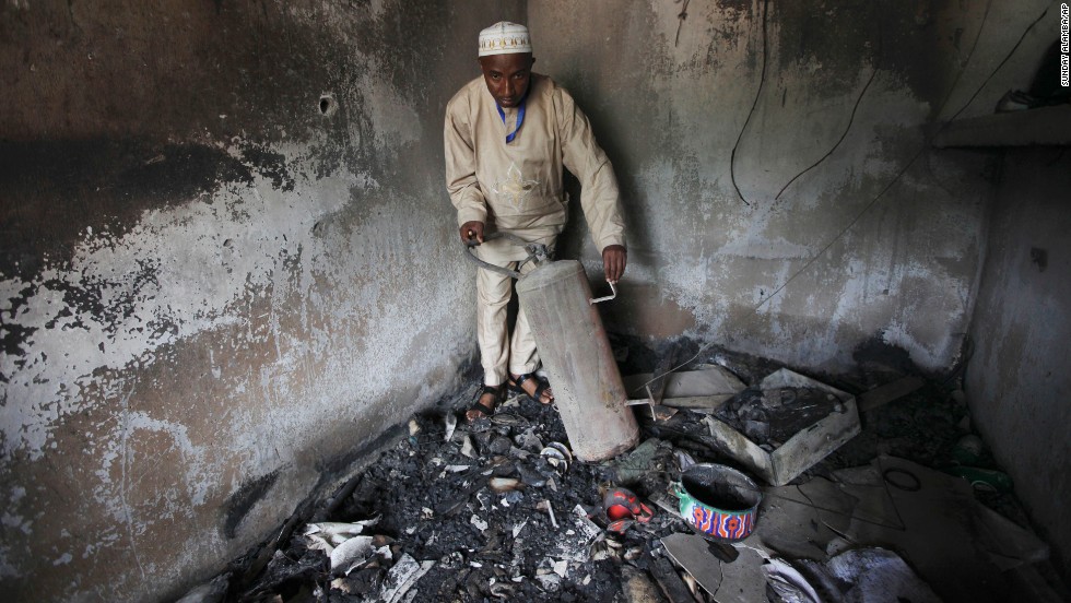 An official displays burned equipment inside a prison in Bauchi, Nigeria, on September 9, 2010, after the prison was attacked by suspected members of Boko Haram two days earlier. About <a href="http://www.cnn.com/2010/WORLD/africa/09/08/nigeria.prison.break/index.html">720 inmates escaped</a> during the prison break, and police suspect the prison was attacked because it was holding 80 members of the sect.