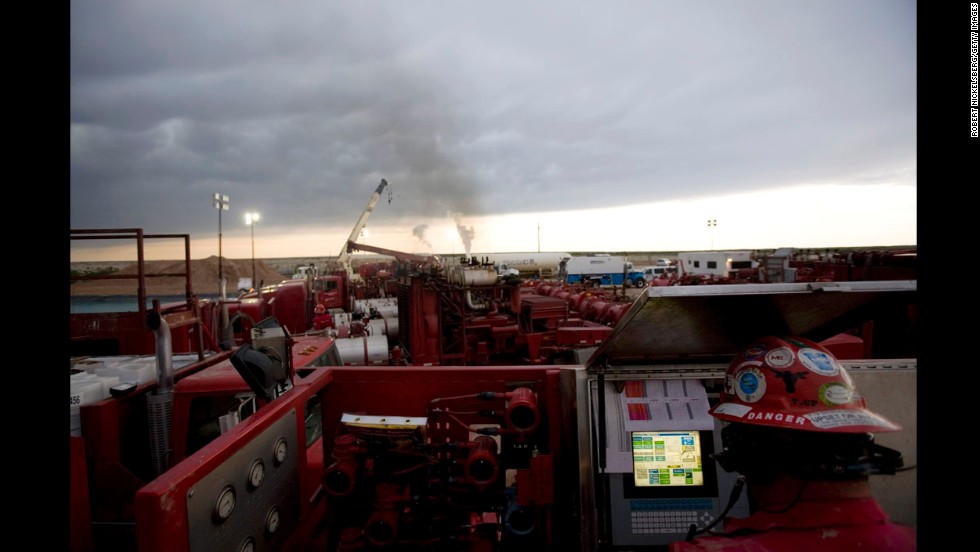 A Halliburton employee monitors a fracking operation outside Hope, New Mexico, in June 2007. Fracking, or hydraulic fracturing, is the process of breaking through dense shale to unlock natural gas.