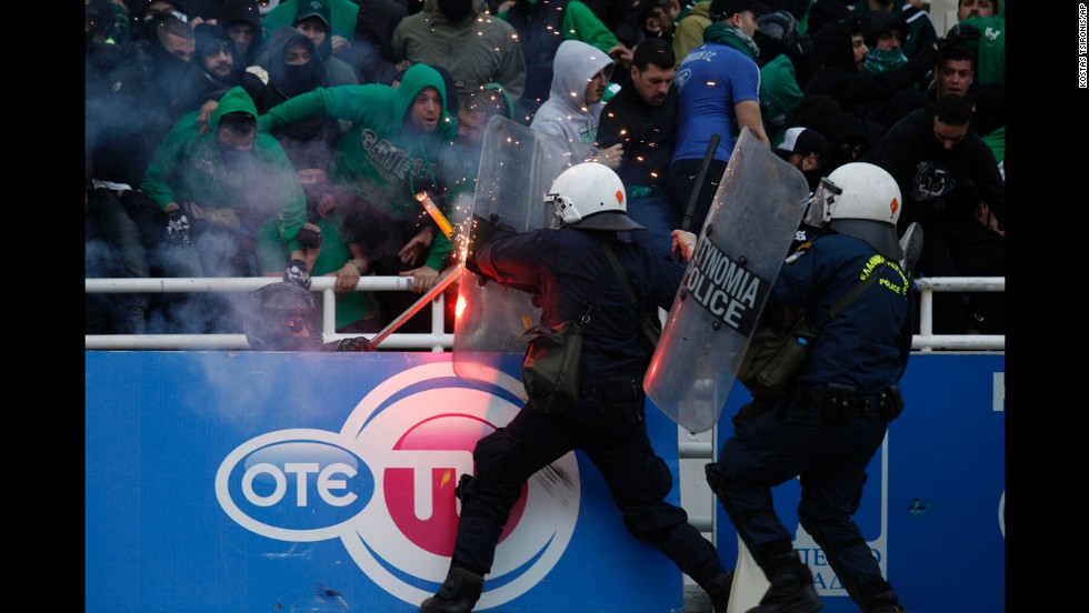 Riot police clash with soccer fans at the Olympic Stadium in Athens, Greece, prior to the Greek Cup final between Panathinaikos and PAOK on Saturday, April 26. Panathinaikos won the game 4-1.