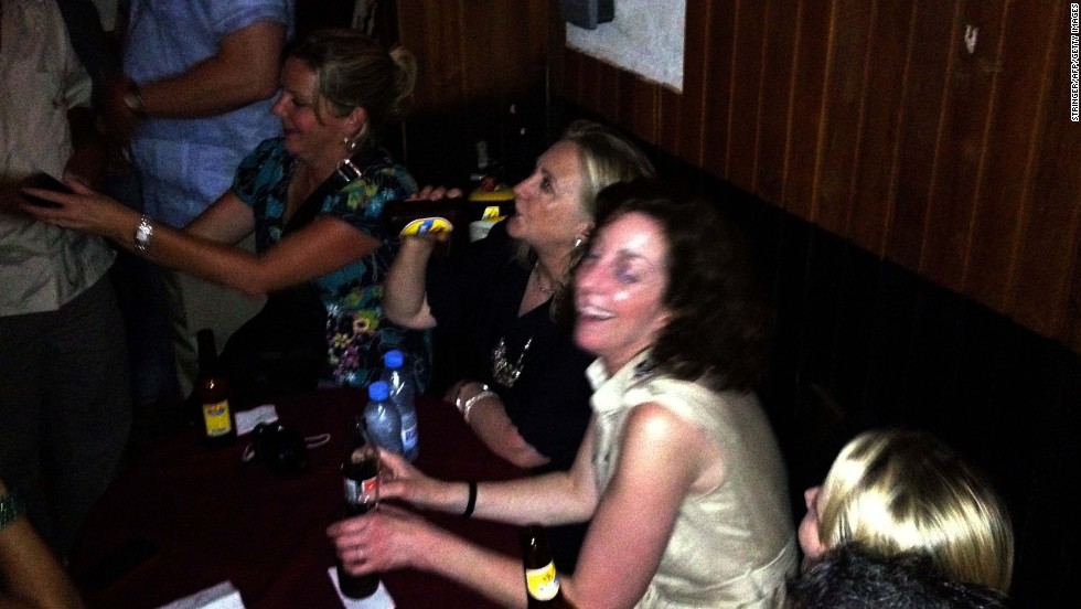 Clinton enjoys a beer at Cafe Havana in Cartagena, Colombia, on April 15, 2012.