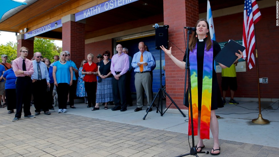 Pastor Carol Hill from Epworth United Methodist Church speaks during a marriage-equality ceremony at the Kathy Osterman Beach in Chicago on Sunday, June 1. June 1 marked the first day that all of Illinois&#39; 102 counties could begin issuing marriage licenses to same-sex couples.
