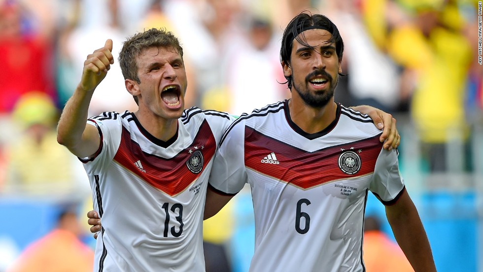 Germany's Thomas Mueller, left, celebrates with Sami Khedira after scoring his team's fourth goal. Mueller scored three of Germany's goals.