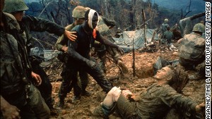 1960s photojournalists showed the world some of the most dramatic moments of the Vietnam War through their camera lenses. LIFE magazine&#39;s Larry Burrows photographed wounded Marine Gunnery Sgt. Jeremiah Purdie, center, reaching toward a stricken soldier after a firefight south of the Demilitarized Zone in Vietnam in 1966. Commonly known as &lt;a href=&quot;http://life.time.com/history/vietnam-war-the-story-behind-larry-burrows-1966-photo-reaching-out/#1&quot; target=&quot;_blank&quot;&gt;Reaching Out,&lt;em&gt;&lt;/a&gt; &lt;/em&gt;Burrows shows us tenderness and terror all in one frame. According to LIFE, the magazine did not publish the picture until five years later to commemorate Burrows, who was killed with AP photographer Henri Huet and three other photographers in Laos.