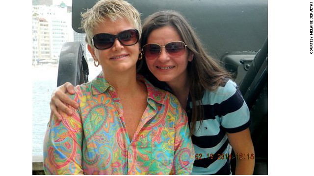 Melanie Servetas (left) was able to return to America with her wife, Claudia Amaral, after DOMA was struck down.