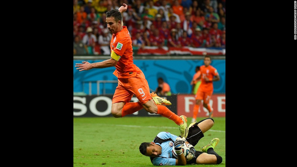 Netherlands forward and captain Robin van Persie, left, fails to score past Costa Rica goalkeeper Keylor Navas.
