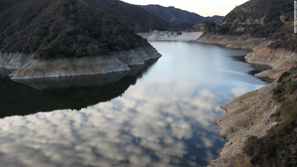 Rocky shores are exposed by the low waters of Morris Reservoir, on the San Gabriel River near Azusa, California, in January 2014.