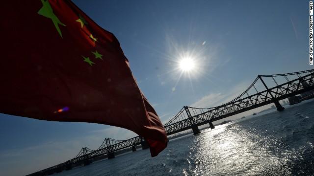 The Chinese flag flies from a boat beneath the Sino-Korean Friendship Bridge which leads to the North Korean town of Sinuiju from the Chinese border town of Dandong on December 16, 2013. China has lost its key North Korean interlocutor with the purging of Kim Jong-Un&#39;s uncle, but analysts say the young leader&#39;s tightening grip on power may be welcomed by Beijing, which prizes stability in its wayward nuclear-armed ally. AFP PHOTO/Mark RALSTON (Photo credit should read MARK RALSTON/AFP/Getty Images)