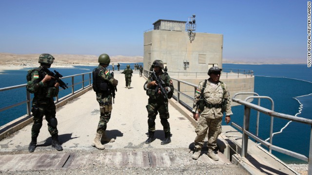 Peshmerga fighters stand guard at Mosul Dam in northern Iraq on Thursday, August 21. With the help of U.S. military airstrikes, Kurdish and Iraqi forces<a href="http://www.cnn.com/2014/08/18/world/meast/iraq-mosul-dam/index.html"> retook the dam</a> from ISIS militants on August 18. A breach of the dam would have been catastrophic for millions of Iraqis who live downstream from it.
