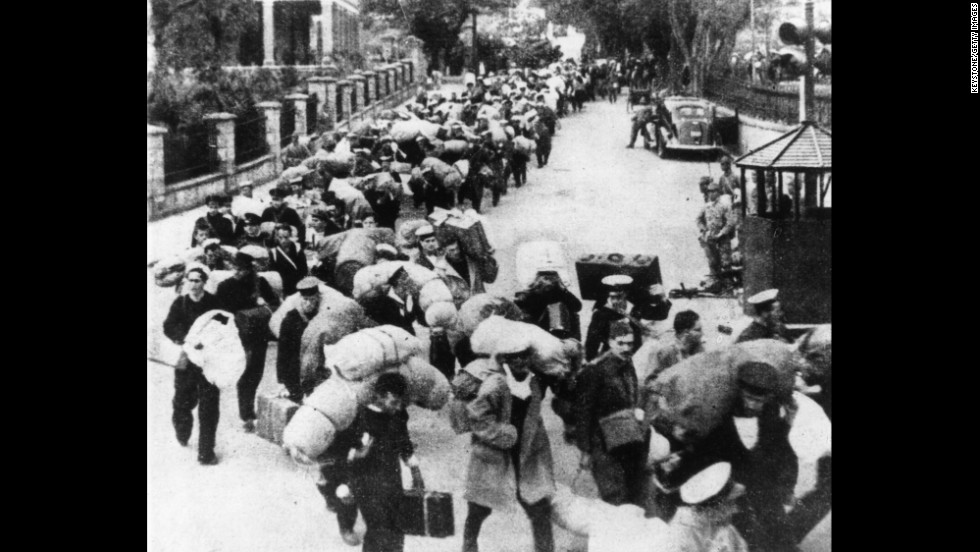 British prisoners of war leave Hong Kong for a Japanese prison camp in December 1941.