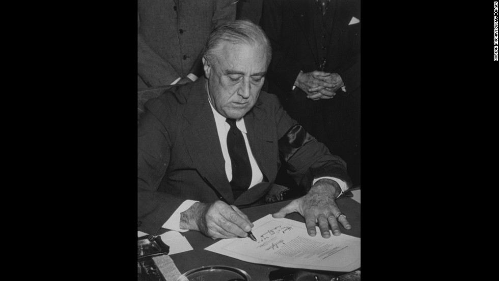 U.S. President Franklin D. Roosevelt signs the declaration of war against Japan on December 8, 1941. Italy and Germany immediately declared war on the United States, and on December 11, Roosevelt signed the U.S. declarations of war against those nations. 