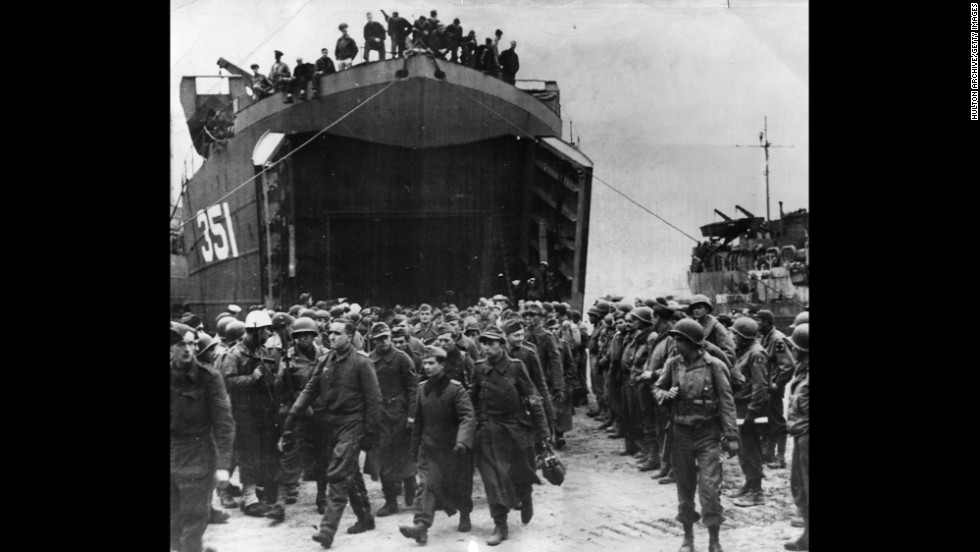 German prisoners captured at the beachhead of Anzio, Italy, leave a landing craft on their way to a prison camp in 1944. The amphibious landing and ensuing battle helped Allied forces break a months-long stalemate south of Rome and ultimately defeat the Germans in Italy.