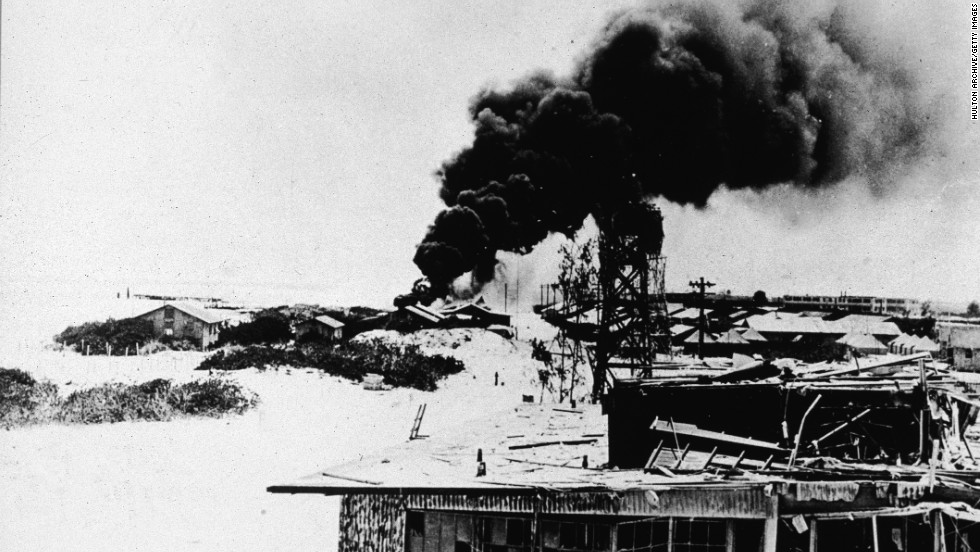 Black smoke rises from demolished buildings after Japanese air forces attacked the U.S. Navy base on Midway Atoll during the Battle of Midway in June 1942. The four-day battle became a major victory for the U.S. Navy, which sunk four Japanese aircraft carriers, and it marked a turning point in the war in the Pacific.