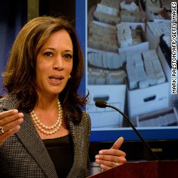 California Attorney General Kamala Harris briefs the media after raids were conducted on money-laundering operations in the Fashion District of Los Angeles on September 10, 2014.  Police staged mass dawn raids in Los Angeles today dubbed &quot;Operation Fashion Police,&quot; seizing $65 million in cash and funds allegedly linked to money-laundering for Mexican drug cartels. Nine people were arrested as some 1,000 officers fanned out in the Fashion District in downtown LA, which one official called the &quot;epicenter of narco-dollar money laundering.&quot;           AFP PHOTO/Mark RALSTON        (Photo credit should read )