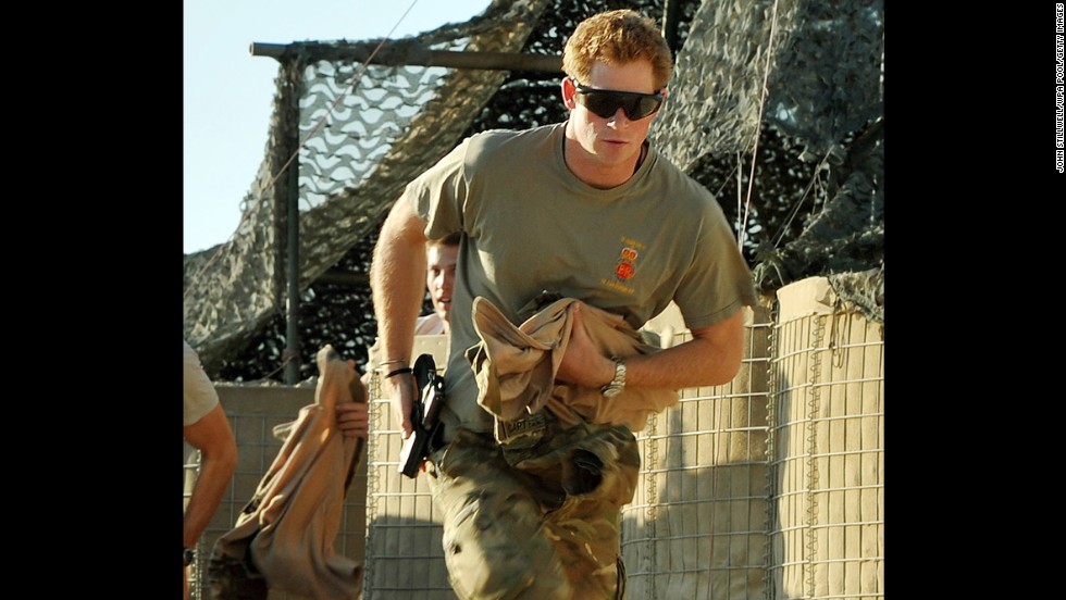 Prince Harry races out from a tent to scramble his Apache with fellow pilots during his 12-hour shift on November 3, 2012, at Camp Bastion in Afghanistan. Prince Harry served as an Apache helicopter pilot and gunner.