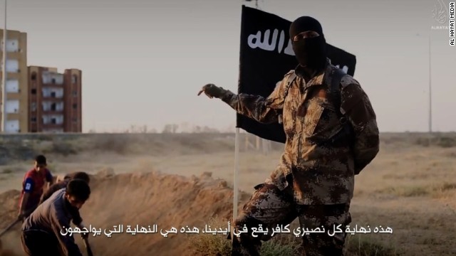 An ISIS fighter who speaks perfect English with a North American accent is shown orchestrating the mass execution of a group of men in an ISIS recruitment video called &quot;Flames of War.&quot;