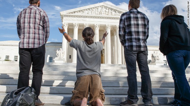 As the U.S. Supreme Court begins its new term this week, pro-life advocates hold a prayer vigil on the plaza of the high court in Washington, Saturday, Oct. 4, 2014. The group, Bound 4 Life, has come to the court for ten years to make a silent appeal against abortion.  (AP Photo/J. Scott Applewhite)