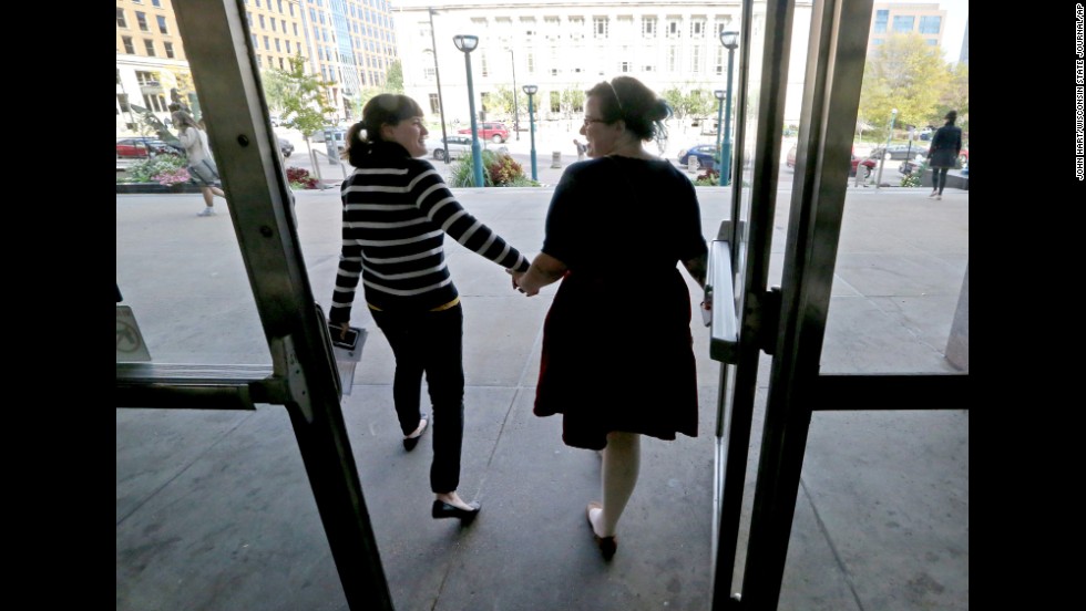 Abbi Huber, left, and Talia Frolkis exit the City County Building in Madison, Wisconsin, after applying for a marriage license on October 6.