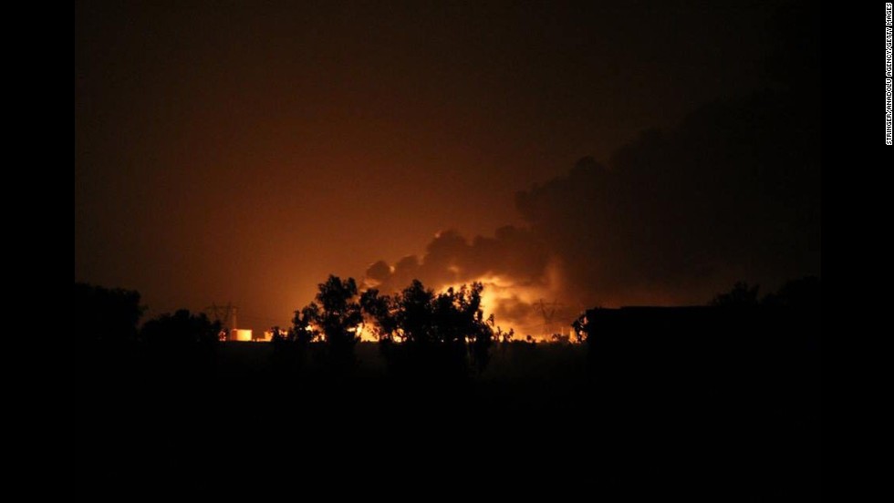A Baiji oil refinery burns after an alleged ISIS attack in northern Selahaddin, Iraq, on Thursday, July 31.