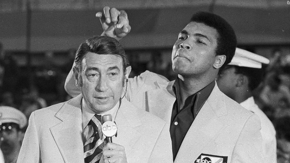 Ali toys with the finely combed hair of television sports commentator Howard Cosell before the start of the Olympic boxing trials in August 1972.