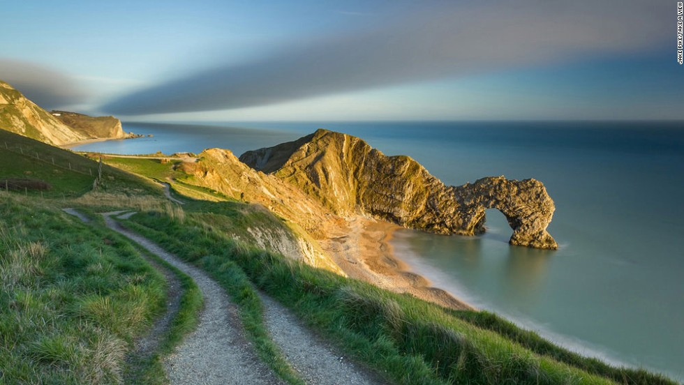 This image by Jake Pike is titled &quot;The last of the evening light on Durdle Door.&quot; &lt;br /&gt;&lt;br /&gt;It shows England&#39;s so-called Jurassic Coast in the southern county of Dorset.&lt;br /&gt;&lt;br /&gt;The crumbling Jurassic Coastline is a favorite among fossil hunters, yielding many paleontological treasures.