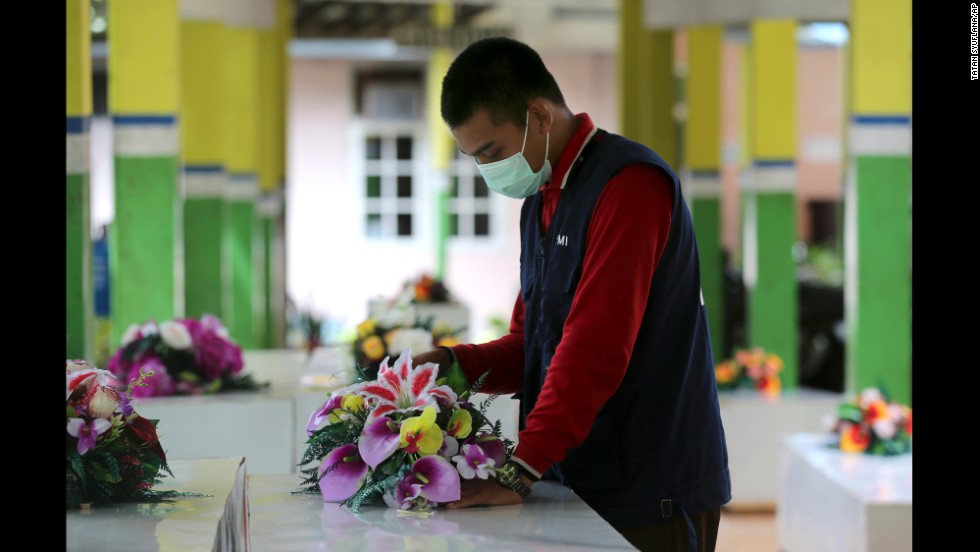 A member of the Indonesian Red Cross prepares coffins at a hospital in Pangkalan Bun on January 2. 