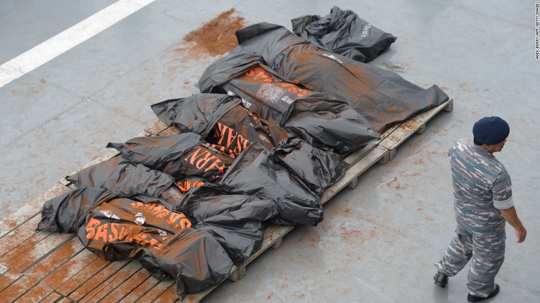 Recovered victims are placed on the deck of the Indonesian ship on January 3. 