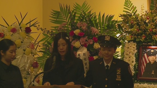 nr sot slain nypd officers wife speaks at funeral _00004025