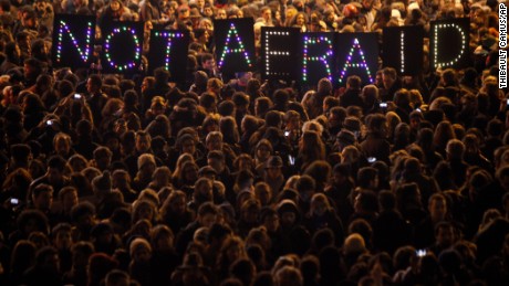 People gather in Paris on Wednesday, January 7, to remember the victims of the Charlie Hebdo terror attack. Earlier in the day, a shooting at the Paris office of satirical magazine Charlie Hebdo left at least 12 people dead, <a href="http://www.cnn.com/2015/01/07/world/gallery/hebdo-paris-shootings-victims/index.html">including four well-known cartoonists</a>.